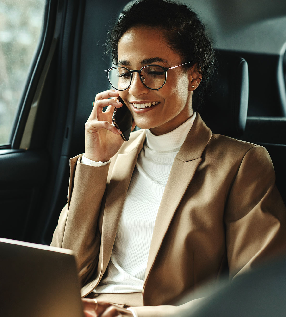 Woman in car speaking on phone Woman in car speaking on phone